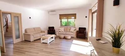 a living room with two couches and a table at VTII & VTI 2 X Private Villas with pool and garden in Albufeira