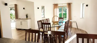a dining room with a glass table and chairs at VTII & VTI 2 X Private Villas with pool and garden in Albufeira