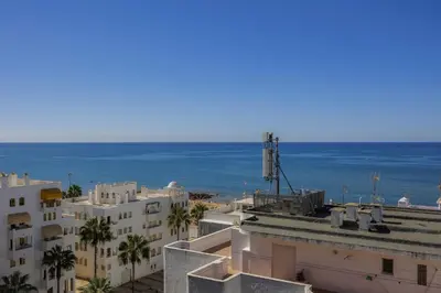 a view of the ocean from a building at Terracos de Quarteira 2 Red by Real Properties in Quarteira