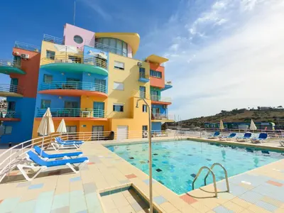 an overhead view of two swimming pools on a cruise ship at Apartment The LightHouse by Interhome in Albufeira