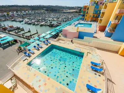 a table on the balcony of a cruise ship at Apartment The LightHouse by Interhome in Albufeira