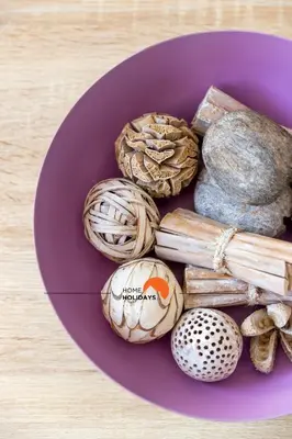 a purple plate of different types of shells on a table at #194 Dream Flat by Home Holidays in Albufeira