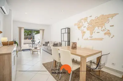 a living room with a flat screen tv on a cabinet at #194 Dream Flat by Home Holidays in Albufeira