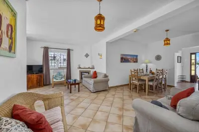 a living room with a couch and a table at Villa Algarhb by Villa Plus in Albufeira