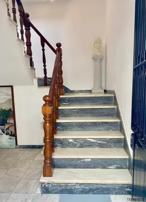 a staircase in a house with blue and white walls at Blife Aerya private rooms - Airport stay in Faro