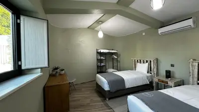 a bedroom with two beds and a window at Mourisca by Check-in Portugal in Vilamoura