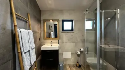 a bathroom with a sink and a glass shower at Mourisca by Check-in Portugal in Vilamoura