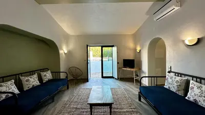 a living room with two blue couches and a table at Mourisca by Check-in Portugal in Vilamoura