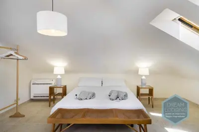 a bedroom with a bed with two elephants on it at Rooftop 27 - Dream Lodging in Albufeira