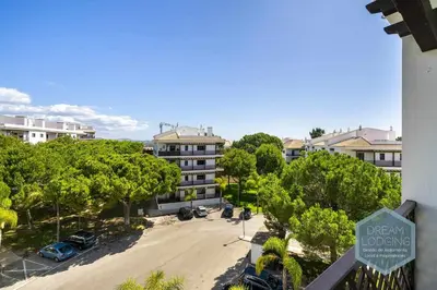 an overhead view of a parking lot in front of a building at Rooftop 27 - Dream Lodging in Albufeira