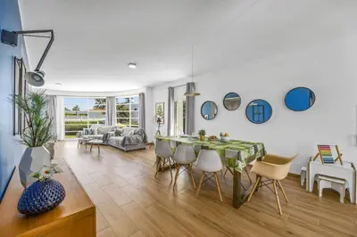 a living room with a table and chairs at Villa Casa Duarte by Villa Plus in Olhos de Água