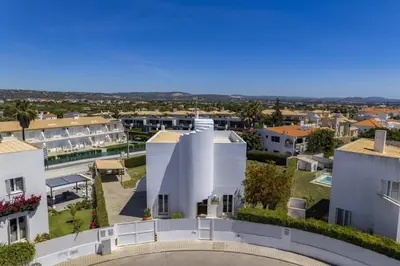 an aerial view of a white building in a city at Villa Casa Duarte by Villa Plus in Olhos de Água