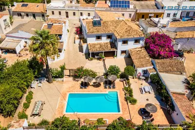 an aerial view of a house with a swimming pool at Quinta Boliqueime by Portucasa in Boliqueime