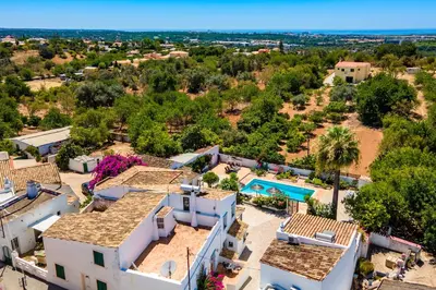 an aerial view of a house with a swimming pool at Quinta Boliqueime by Portucasa in Boliqueime