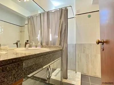 a bathroom with a sink and a shower at Blife Anya private rooms in Faro