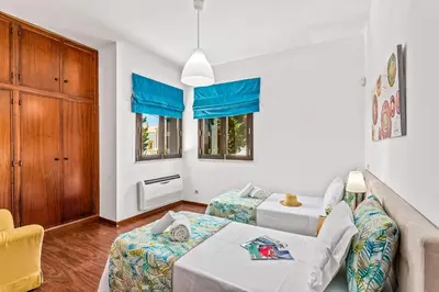 a living room with a couch and a table at Villa Karlia by Villa Plus in Galé