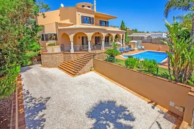 an image of a house with a swimming pool at Villa Karlia by Villa Plus in Galé