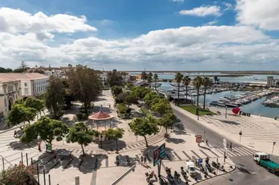 an aerial view of a city with a marina at Blife Chelsya private rooms in Faro