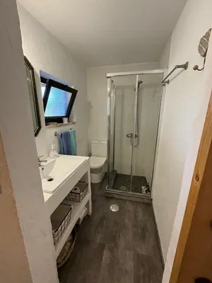 a kitchen with a sink and a counter top at Lugar das Andorinhas in Olhos de Água