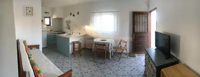 a bathroom with a toilet and a sink and a mirror at Lugar das Andorinhas in Olhos de Água