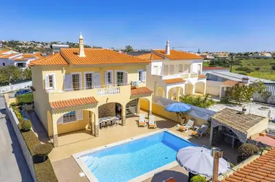 an aerial view of a house with a swimming pool at Villa Graca by Villa Plus in Albufeira