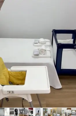 a room with a white bed and a yellow chair at Casa Tapada do Bento I- Albufeira in Albufeira