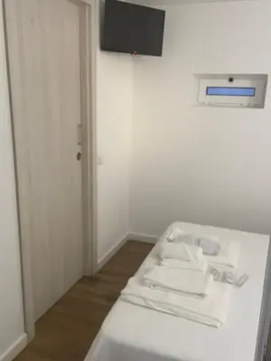 a room with a bed and a tv on a wall at Casa Tapada do Bento I- Albufeira in Albufeira