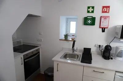 a small kitchen with a sink and a stove at Casa Tapada do Bento I- Albufeira in Albufeira
