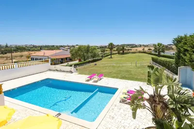 a swimming pool with a view of a house at Villa Luis Gale by Villa Plus in Galé