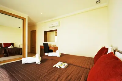 a bedroom with a bed with two stuffed animals on it at Villa Anna by Algarve Vacation in Albufeira
