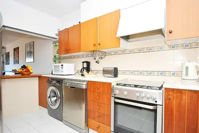 a kitchen with a stove and a dishwasher at Apartment Formentera by Algarve Vacation in Albufeira
