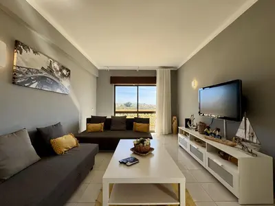 a small bedroom with a bed and a window at Albufeira Central 8 by Homing in Albufeira