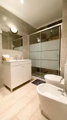 a bathroom with a sink and a toilet at Spacious 1 bed in Vilamoura, Fast Wifi & Pool in Quarteira