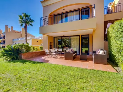 a home with a patio and lawn at AL - Vila Sol Golfside Ground Floor in Vilamoura