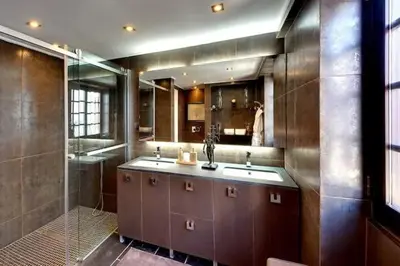 a large bathroom with two sinks and a shower at Casa Chanel - Ocean front with rooftop SPA Jacuzzi in Albufeira