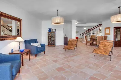 a living room with blue couches and chairs at Villa Costa Rica in Galé