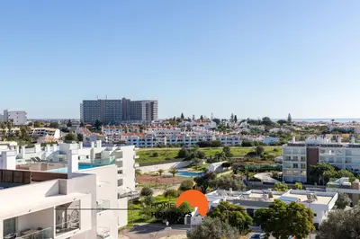 an aerial view of a city with buildings at #200 Panoramic Flat by Home Holidays in Albufeira
