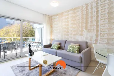 a living room with a couch and a table at #200 Panoramic Flat by Home Holidays in Albufeira