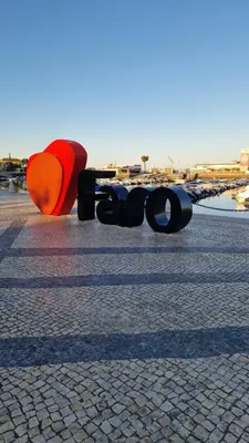 a group of objects sitting on a street at Domek v srdci Fara in Faro