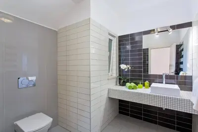 a bathroom with a sink and a toilet at Villa Sandra by Villa Plus in Olhos de Água