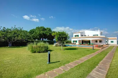 a house with a large yard with a pool at Villa Sandra by Villa Plus in Olhos de Água