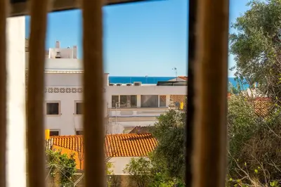 a view of a building from a window at Gyula Old Town Apartment in Albufeira