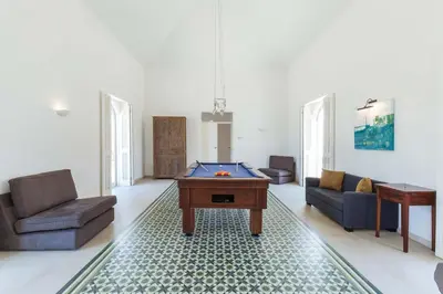 a living room with a pool table in it at Villa Ataboeira in Guia