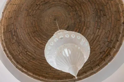a white fan hanging from a ceiling at Villa alhabu in Albufeira
