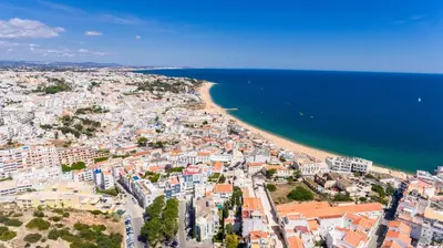 an aerial view of a city and a beach at Guerreiros Lovely Stay in Albufeira