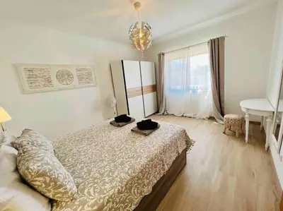 a bedroom with a large bed and a window at Charming 5 bed Private Villa - Quarteira in Quarteira