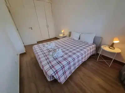 a bedroom with a bed with two stuffed animals on it at The Albufeira Concierge - Prime Beach Center L3 in Albufeira