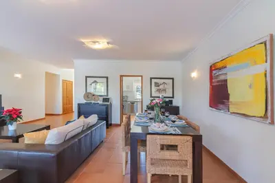 a living room with a couch and a table at Vilamoura - VILLA VINTE in Vilamoura