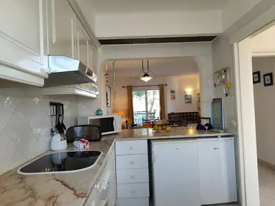 a kitchen with a sink and a counter top at Albufeira Balaia Golf Vilage 4 With Pool by Homing in Albufeira