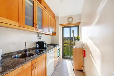 a kitchen with a sink and a counter top at Algarve Paraíso - Monte da Balaia in Olhos de Água